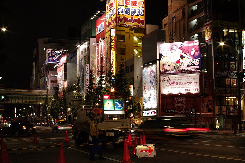 Anime billboards lining the streets of Akihabara, Tokyo, showcasing Japanese animation culture in 2012