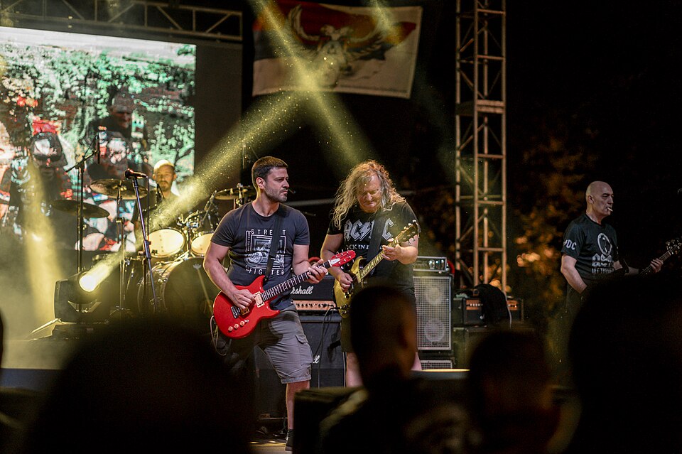 Live rock concert with vibrant stage lights