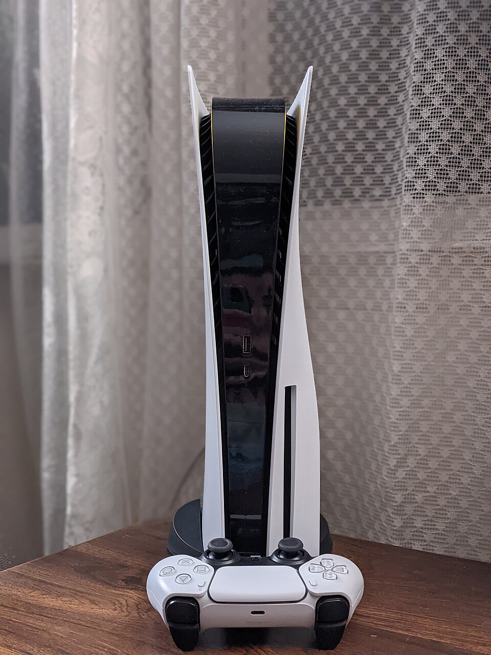 PlayStation 5 and DualSense controller side view