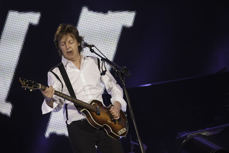Paul McCartney performing live on stage during Out There tour