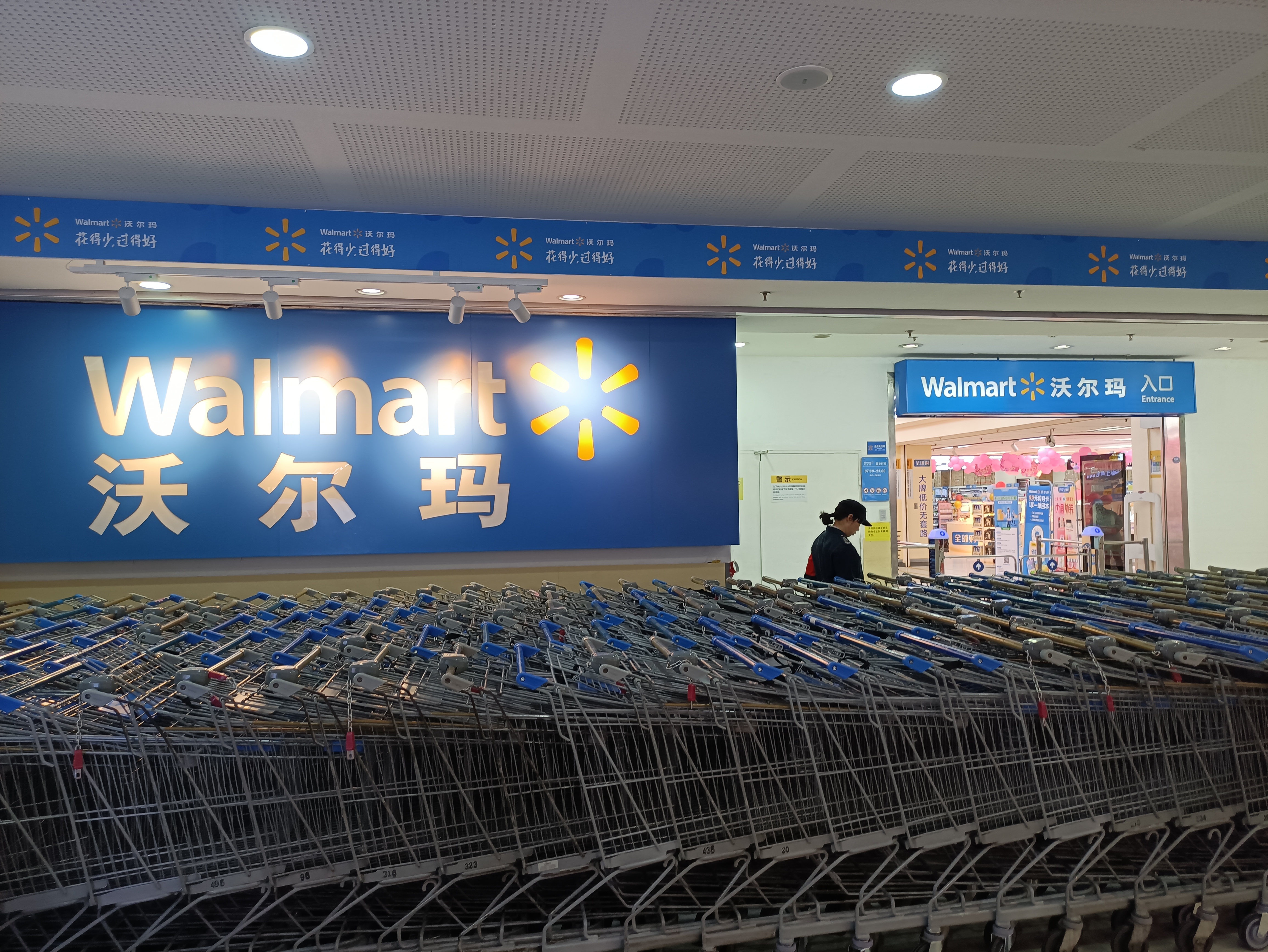 Walmart store front entrance in shopping district